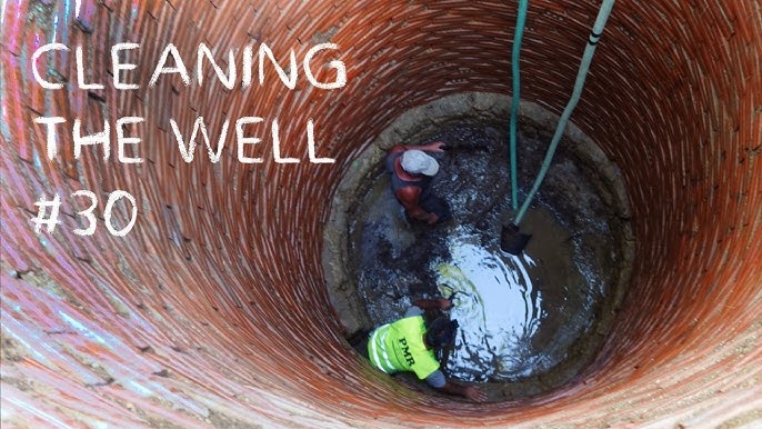 A man removing an old well pump