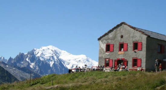 The Kredarica hut, Slovenia's highest mountain hut, perched on a rocky peak in Triglav National Park.