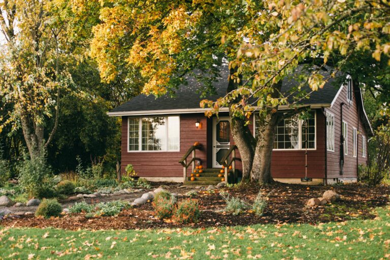 A person tending to their autumn garden.
