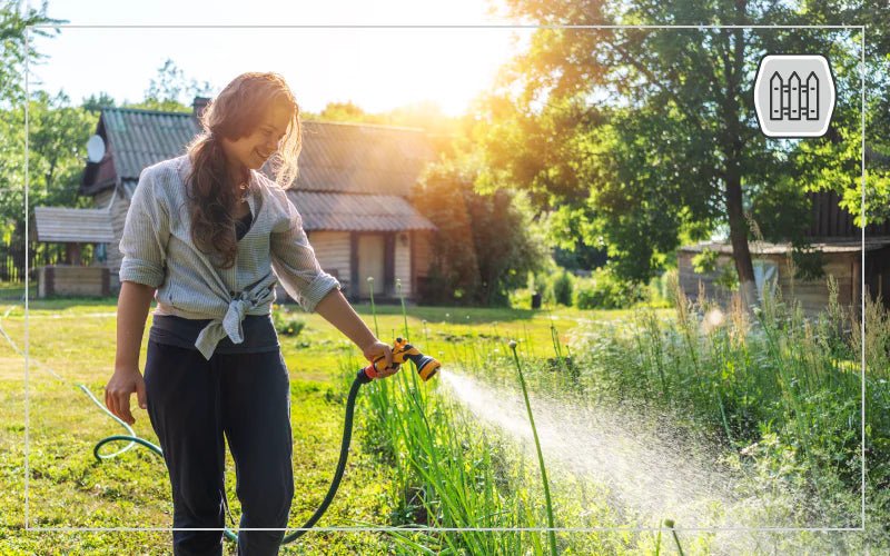 A diverse landscape featuring a well-maintained garden and a modern building, showcasing essential elements of homestead infrastructure.