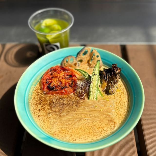 A modern vegan ramen bowl, showcasing the vibrant colors of the vegetables and the rich broth.