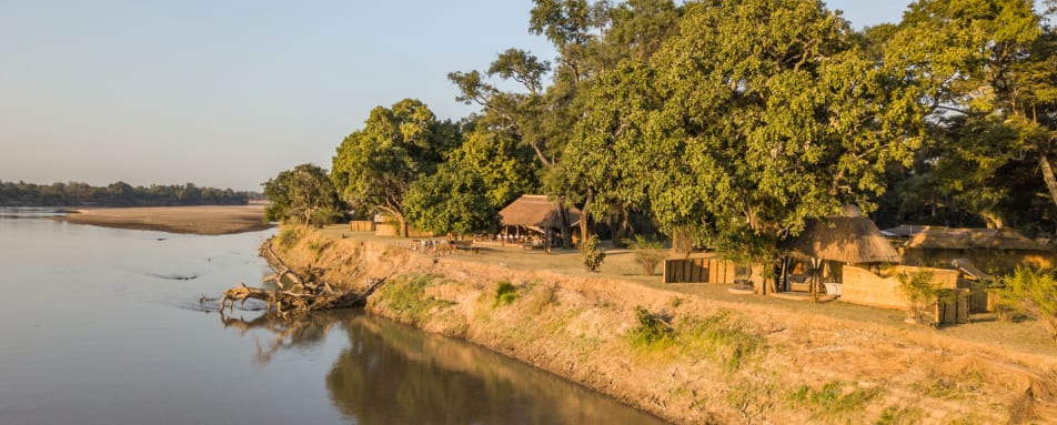 Close-up of animal tracks in the sand, illustrating the process of tracking wildlife on foot.