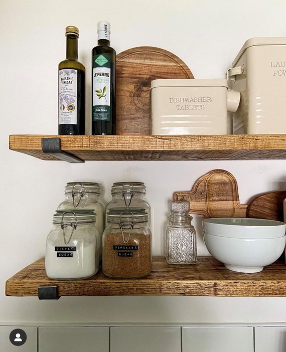 Glass jars repurposed as pantry storage containers for dried goods