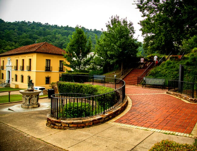 Sarah and Mark rappelling down a waterfall, showcasing the thrill of the activity.