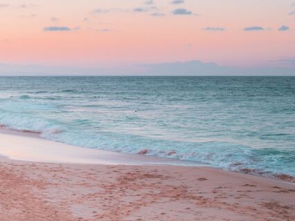 Abstract shots capturing the rippling patterns in the sand caused by the sound waves.