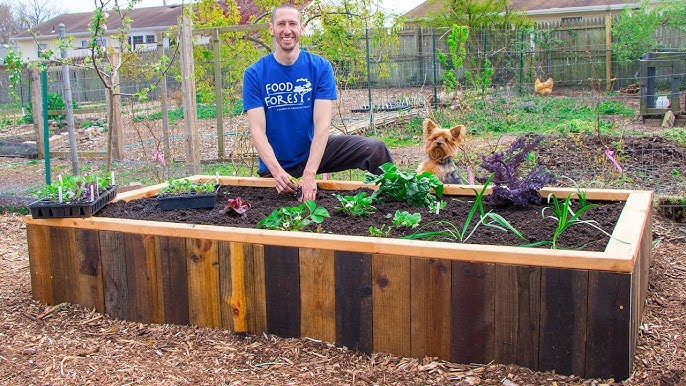Image of a personalized raised garden bed with decorations
