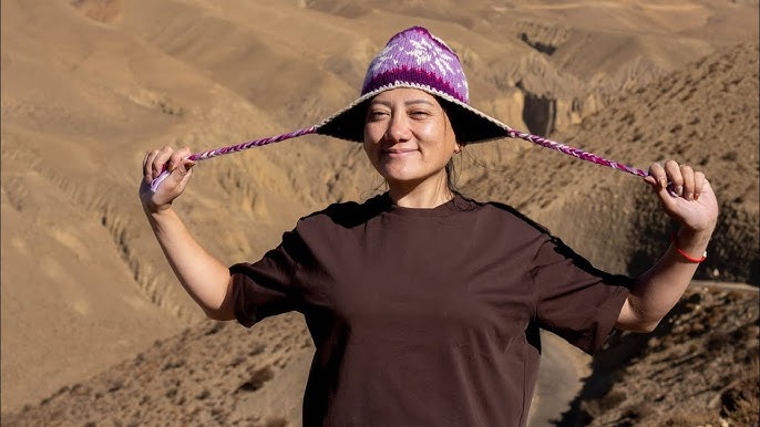 A traditional Nepali teahouse in the Annapurna region, with prayer flags fluttering in the wind