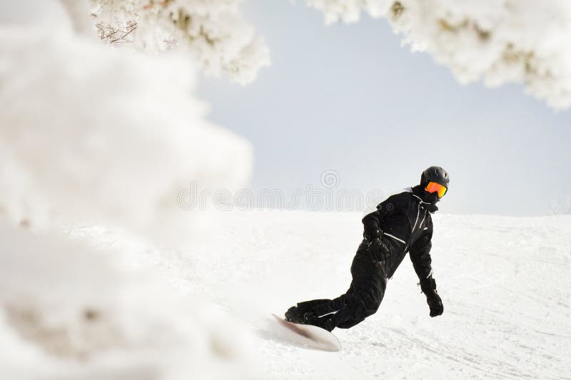 Skier carving down a slope