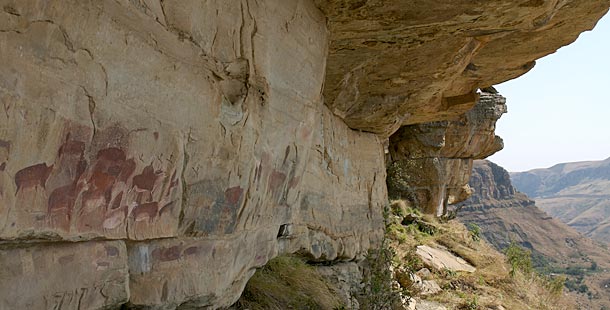 A close-up image of a local artisan handcrafting cheese in Gruyères, emphasizing the texture of the cheese and the artisan's weathered hands.