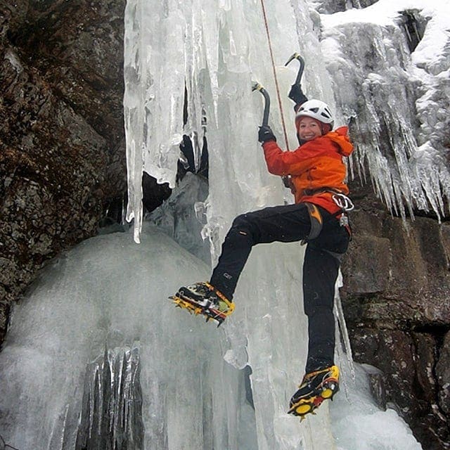 Ice climber on a steep ice wall in Antarctica