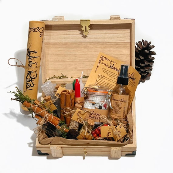 A serene Winter Solstice altar featuring candles, crystals, pinecones, and a Winter Solstice herb bundle as the central focal point.