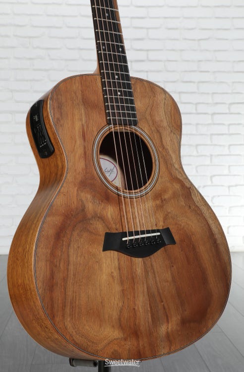 Silhouette of two teenagers hunched over their phones with flashlights inside a tent at night, while their parents try to sleep