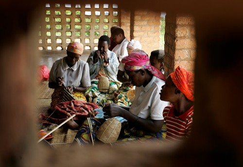 Close-up of an artisan weaving an Agaseke basket