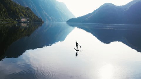 Volunteers sorting the plastic debris collected on the beach, categorizing it for recycling. Focus on emotion and the shock of the sheer volume