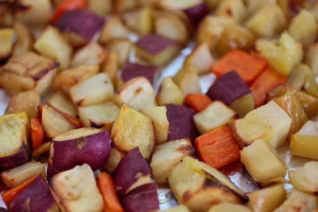 Root vegetables and fruit stored neatly in a root cellar, illustrating proper organization and preservation