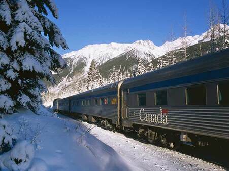 featured image of train travelling through snowy mountains
