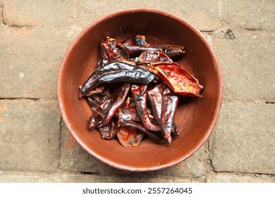 A Tlayuda being prepared on a large comal.
