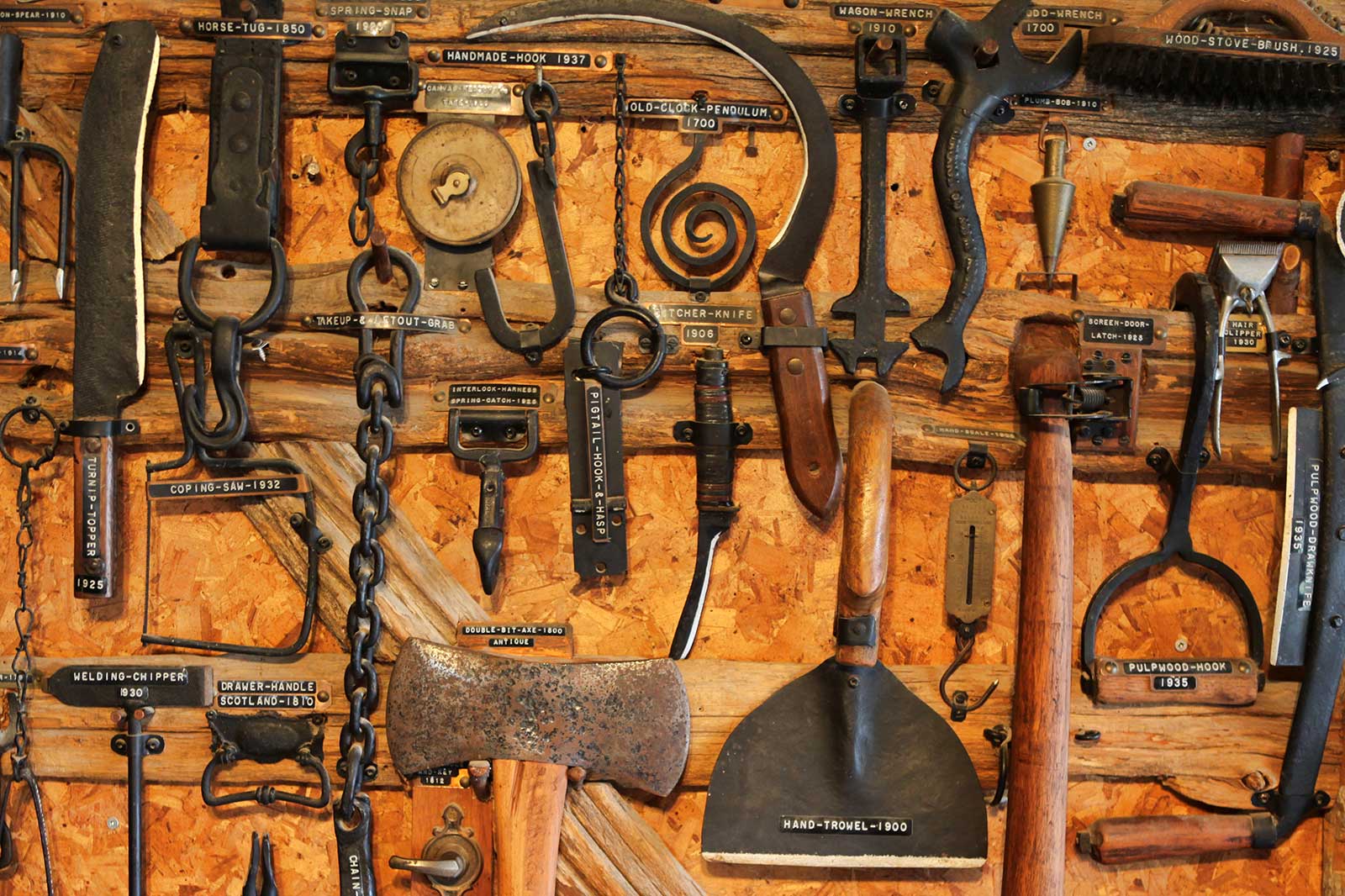 homesteader inspecting garden tool for rust