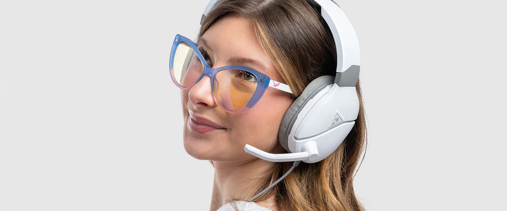 Overhead product shot showcasing the SteelSeries Arctis Nova Pro Wireless headset's GameDAC unit, with emphasis on the input/output ports and control knob. Use sharp focus and detailed lighting to highlight the texture of the materials.