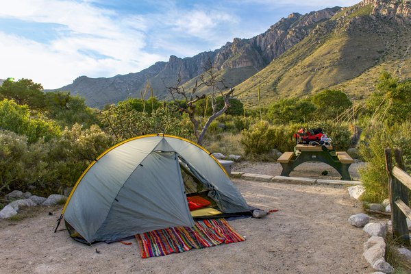 Timelapse photo of the Milky Way over a snow-covered tent in Spray Valley Provincial Park.