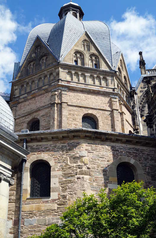 Facade of the Palatine Chapel in Aachen, a Carolingian architectural masterpiece completed circa 805 AD, demonstrating advanced construction techniques and aesthetic design consistent with the period.