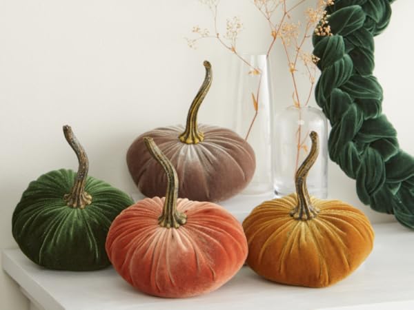 A kitchen scene showcasing fall colors, candles, pumpkins, and wooden elements, embodying the hygge aesthetic.