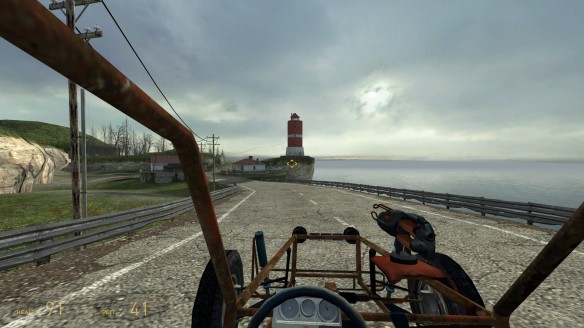 A player is using the Gravity Gun to defend against Antlions in the Sandtraps level, using environmental objects as makeshift shields and weapons.