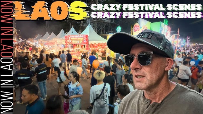 Monks in saffron robes participating in the alms giving ceremony in Luang Prabang
