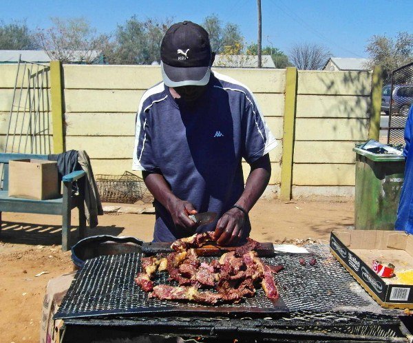 A panoramic view of the desolate Skeleton Coast, showcasing its shipwrecks and rugged coastline.