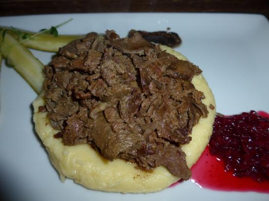 A photo of the Arctic TreeHouse Hotel nestled among snow-covered trees, showcasing its unique architecture and harmonious integration with the surrounding natural environment.