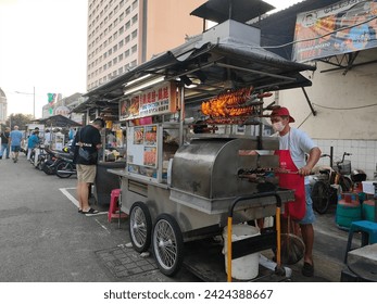 A vibrant shot of a steaming bowl of Penang Laksa