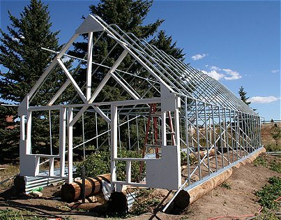 A person is building a raised garden bed.