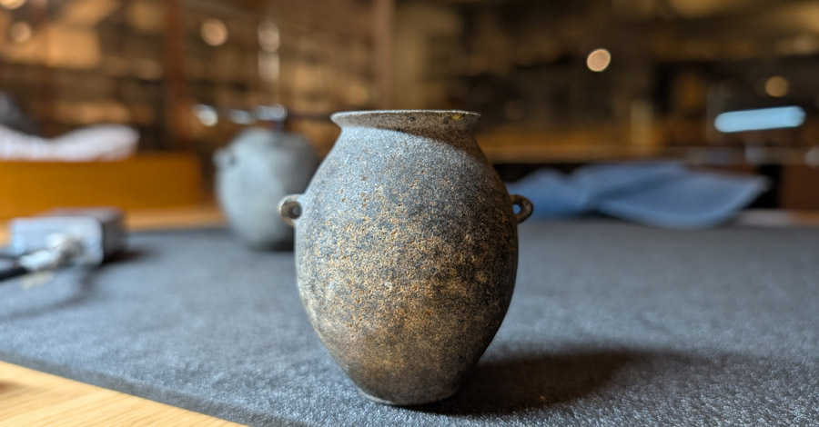 Close up of a stone vessel.