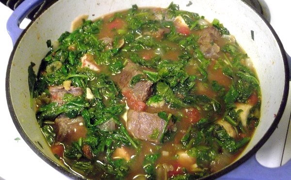 An appetizing photograph of Romazava, showcasing its presentation and the ingredients.