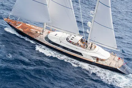 A yacht sailing in crystal clear waters