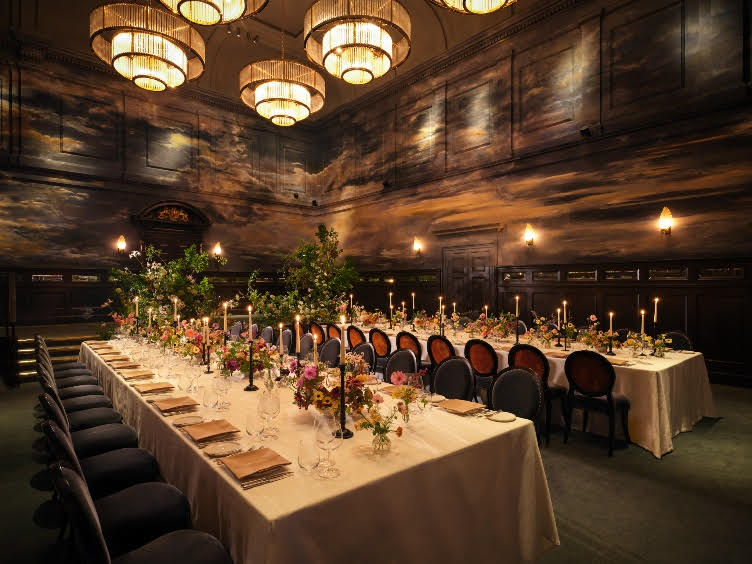 A grand courtroom setting at The NoMad London, showcasing the blend of historical architecture and modern event design, embodying a luxurious and unique atmosphere.