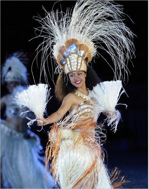 The iconic Needle, or Te Rua Manga, standing tall in the center of Rarotonga, surrounded by lush greenery.