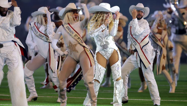 Close-up image of Beyoncé performing the signature hand wave from 