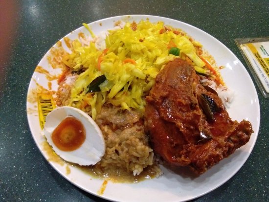 A colorful display of various curries and dishes at Hameediyah Restaurant