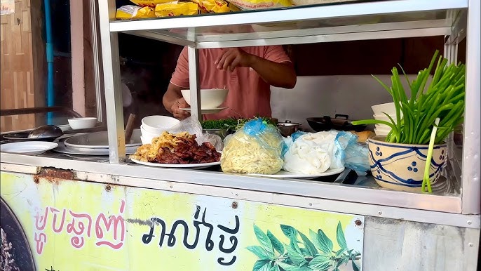 A steaming bowl of Kuy Teav noodle soup.