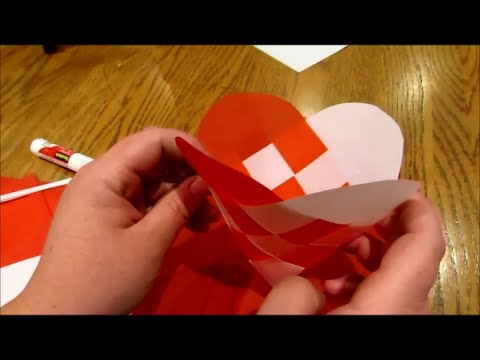 A step-by-step visual guide showing how to bend and secure the pine boughs into a heart shape.