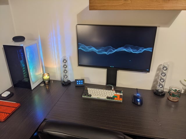 Clean, minimalist PC build inside the NZXT H1 V2 case, showcasing the cable management and lack of RGB.