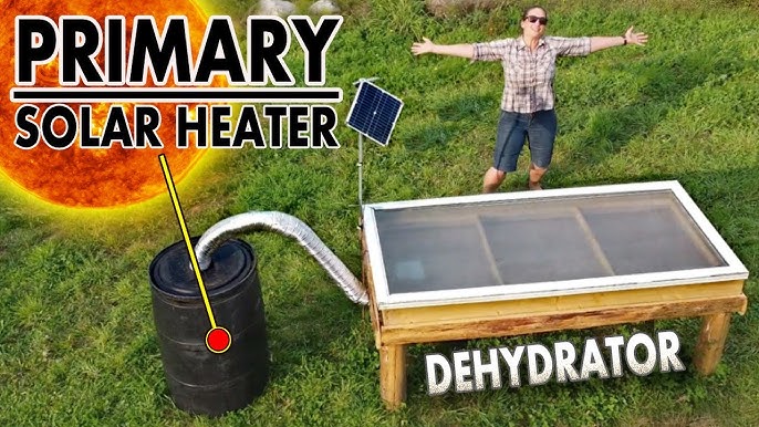 A completed solar dehydrator being held up outside