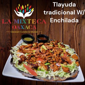 A crispy tlayuda topped with various ingredients