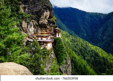 Bhutanese architecture featuring intricate wood carvings and colorful Buddhist symbols.