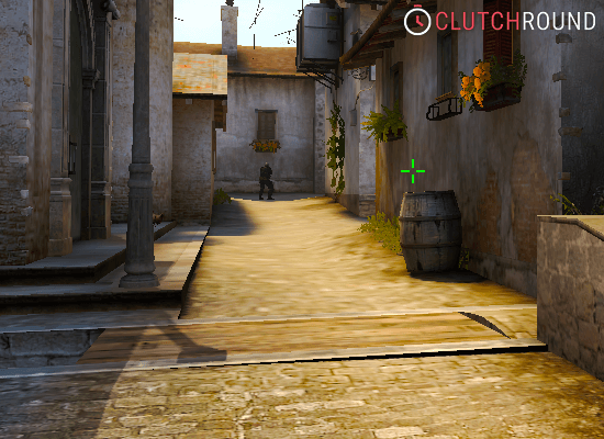 A CT player standing guard in a narrow Italian alley in CS:Source, emphasizing the close-quarters combat scenarios and tight spaces.