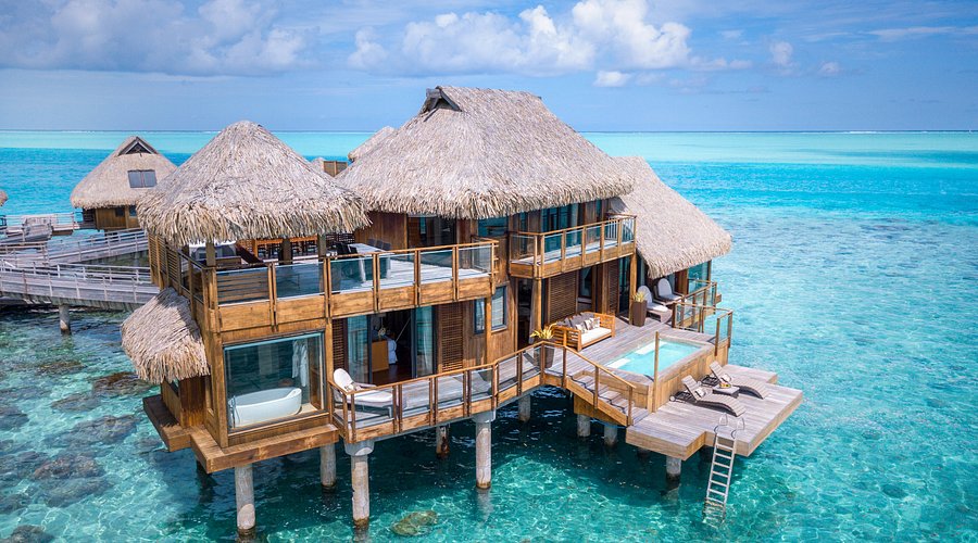 Exterior view of overwater bungalows at The St. Regis Bora Bora Resort