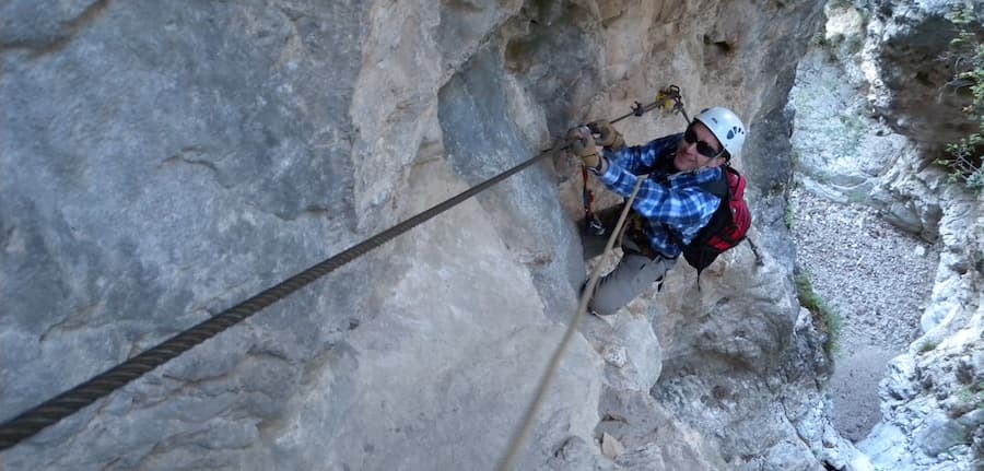 Adventurer standing in the snowy forest, peacefully meditating with a serene smile.