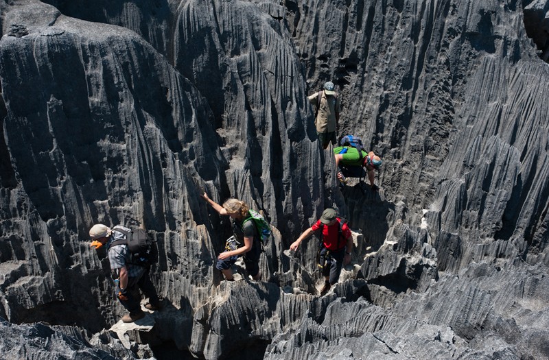 A local Malagasy woman selling food in a bustling market