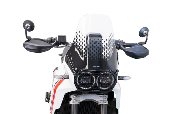 Sand tobogganing on Moreton Island, a group of people racing down a dune on colorful toboggans